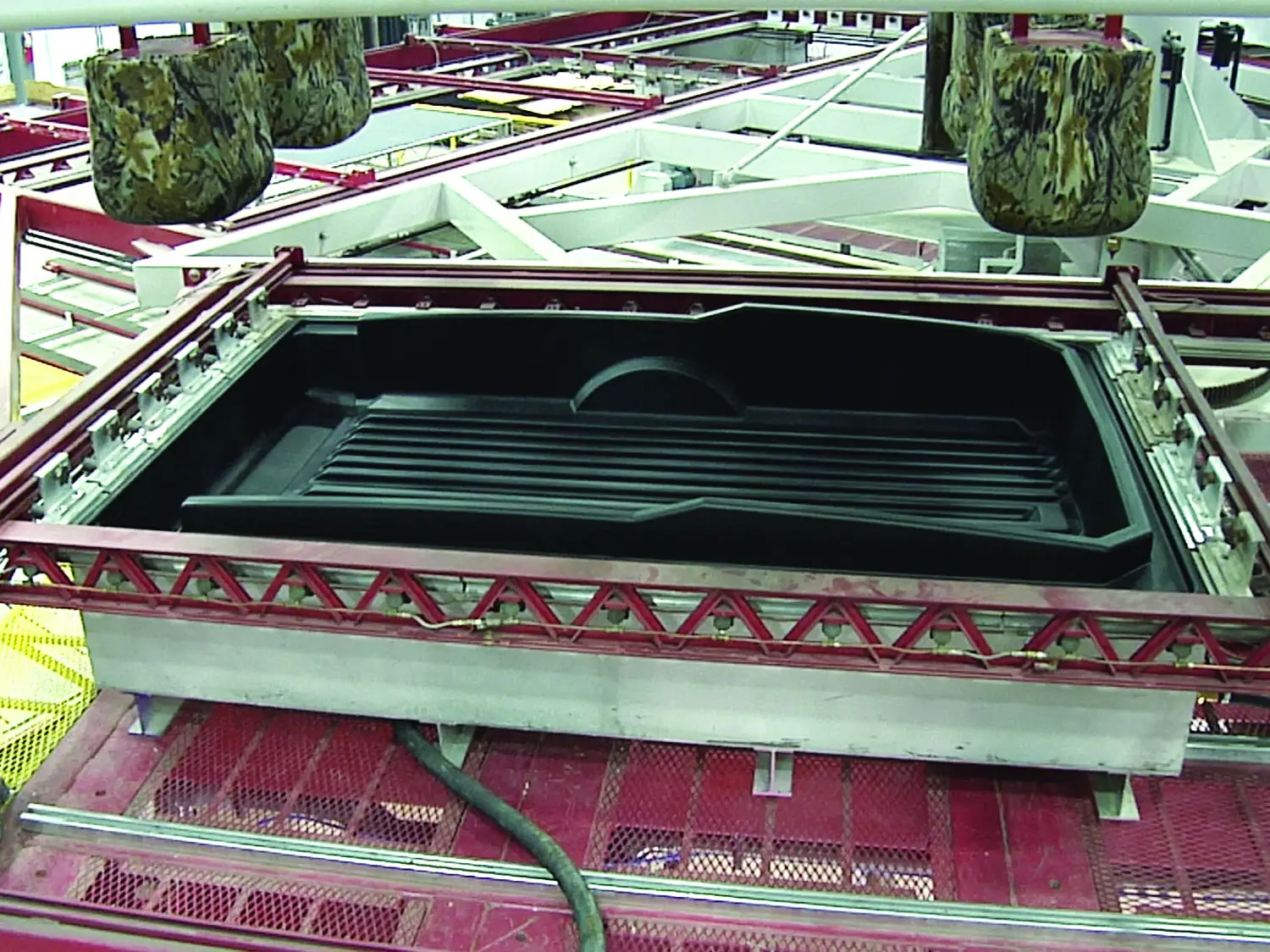 Single-piece thermoformed part replacing a welded sheet-metal assembly